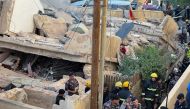 Rescuers work at the site of a four-storey residential building collapse in Amman, Jordan September 13, 2022. REUTERS/Jehad Shelbak