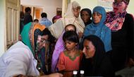 Flood victims receive medical assistance at a medical camp, following rains and floods during the monsoon season, in Manjhand town, in Jamshoro, Pakistan, on September 12, 2022. (REUTERS/Yasir Rajput)