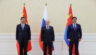 Chinese President Xi Jinping, Russian President Vladimir Putin and Mongolian President Ukhnaa Khurelsukh pose for a picture during a meeting on the sidelines of the Shanghai Cooperation Organization (SCO) summit in Samarkand, Uzbekistan, on September 15, 2022. Sputnik/Alexandr Demyanchuk/Pool via REUTERS