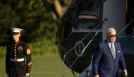 US President Joe Biden walks from Marine One to the White House following a trip from Michigan, in Washington on September 14, 2022. REUTERS/Tom Brenner