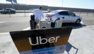 Uber signage is posted at Los Angeles International Airport (LAX) in Los Angeles, California, on July 10, 2022. REUTERS/David Swanson/File Photo