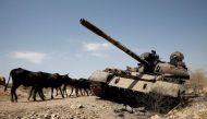 Cows walk past a tank damaged in fighting between Ethiopian government and Tigray forces, near the town of Humera, Ethiopia, on March 3, 2021. File Photo / Reuters
