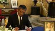 Kelly Hsieh, Taiwan's representative in London, signs the condolence book for Britain's Queen Elizabeth at Lancaster House in London, Britain, in this undated handout image released on September 18, 2022. Taiwan Ministry of Foreign Affairs/Handout via REUTERS