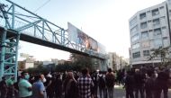 People attend a protest over the death of Mahsa Amini, a woman who died after being arrested by the Islamic republic's 