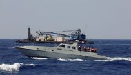 A Lebanese navy ship takes the family members of migrants missing since a boat sunk in April, on a tour of an area where a submarine was being prepared to search for the wreck of the boat off the Lebanese coast of Tripoli, Lebanon August 22, 2022.  File Photo / Reuters
