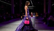 A model presents a creation from the Versace Spring/Summer 2023 collection during Milan Fashion Week in Milan, Italy, September 23, 2022. Reuters/Alessandro Garofalo
 