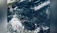 Tropical Storm Ian is seen near the coast of Cuba in this satellite image taken September 25, 2022. National Oceanic and Atmospheric Administration (NOAA)/Handout via Reuters
