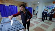 A woman casts her ballot at a polling station during a referendum on the joining of the self-proclaimed Donetsk People's Republic (DPR) to Russia, in Donetsk, Ukraine September 27, 2022. Reuters/Alexander Ermochenko