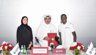 Internet sensation Khabane ‘Khaby’ Lame (first right) with Ali Rashid Al Mohannadi (centre), QNB Group’s Executive General Manager and Group Chief Operating Officer, and Heba Ali Al Tamimi, General Manager of QNB Group Communications, during the signing ceremony and TVC screening at the Mall of Qatar, yesterday. 
