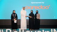 Sheikh Mohammed bin Abdulla Al Thani, CEO at Ooredoo Qatar, presenting the Ooredoo Award to a winner.