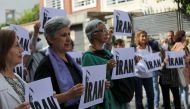 People take part in a protest in front of the Iranian Embassy in support of anti-regime protests in Iran following the death of Mahsa Amini, in Madrid, Spain on September 28, 2022. REUTERS/Violeta Santos Moura
 