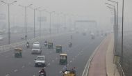 Vehicles are seen on a highway on a smoggy morning in New Delhi, India, December 2, 2021. REUTERS/Anushree Fadnavis
