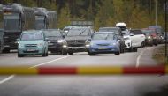 Russian cars and buses line up at the Vaalimaa border check point between Finland and Russia, in Virolahti, Finland September 30, 2022. Lehtikuva/Sasu Makinen via REUTERS
