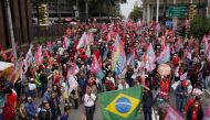Supporters of Brazil's former President and presidential candidate Luiz Inacio Lula da Silva take part in a silent march, in Sao Paulo, Brazil, on October 1, 2022. REUTERS/Mariana Greif