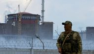 A serviceman with a Russian flag on his uniform stands guard near the Zaporizhzhia Nuclear Power Plant in the course of Ukraine-Russia conflict outside the Russian-controlled city of Enerhodar in the Zaporizhzhia region, Ukraine August 4, 2022. File Photo / Reuters
