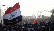 Iraqi protesters gather to mark the third anniversary of the anti-government protests in Baghdad on October 1, 2022. REUTERS/Thaier Al-Sudani
 
