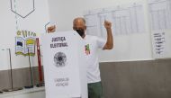 A supporter of Brazil's former President Luiz Inacio Lula da Silva, Charles Bastos, reacts as he casts his vote at a polling station, in Brasilia, Brazil October 2, 2022. Reuters/Adriano Machado