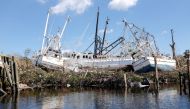 Stranded shrimp boats are seen in the Matanzas Pass after Hurricane Ian caused widespread destruction in Fort Myers Beach, Florida, on October 1, 2022. REUTERS/Marco Bello