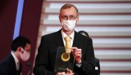 File photo of Swedish geneticist Svante Paabo with his Japan Prize 2020 trophy in Tokyo, Japan April 13, 2022. Eugene Hoshiko/Pool via Reuters 