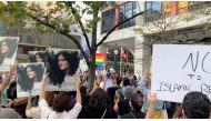 People attend a protest in solidarity with the women in Iran, following the death of Mahsa Amini, in Toronto, Canada, on September 19, 2022 in this screen grab obtained from social media video obtained by REUTERS.
