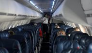Flight attendants talk in a nearly empty cabin on a Delta Airlines flight operated by SkyWest Airlines during a flight departing from Salt Lake City, Utah, US on April 11, 2020. File Photo / Reuters
