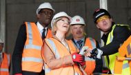 British Prime Minister Liz Truss and Chancellor of the Exchequer Kwasi Kwarteng react during a visit to a construction site for a medical innovation campus, on day three of the Conservative Party annual conference at the International Convention Centre in Birmingham, Britain, on October 4, 2022. Stefan Rousseau/Pool via REUTERS