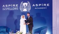 Deputy Director General of Aspire Academy Ali Salem Afifa presents a memento to English football legend David Beckham.