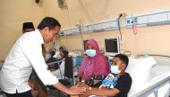 Indonesian President Joko Widodo meets victims of a riot and stampede following a soccer match between Arema vs Persebaya Surabaya in Malang, East Java province, Indonesia, October 5, 2022. (REUTERS) 