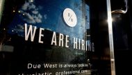 A help wanted sign at a store along Queen Street West in Toronto Ontario, Canada, June 10, 2022. (REUTERS/Carlos Osorio)
