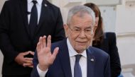 Austrian President Alexander Van der Bellen waves outside the polling station during presidential elections in Vienna, Austria, October 9, 2022. (REUTERS/Leonhard Foeger)