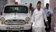 File photo of India's Samajwadi Party chief Mulayam Singh Yadav walks next to his official government car at his residence in Lucknow, northern India, September 28, 2012. Reuters/Pawan Kumar 