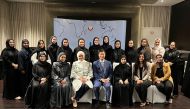 Zainab Al Suwaij with officials and participants during a workshop in Doha. 