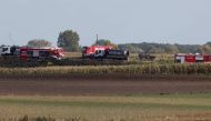 Firefighters work in the field near the Druzhba pipeline where an oil leak was detected, near the village of Zurawice, Poland, October 12, 2022. Reuters/Kacper Pempel