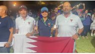 Qatar’s Nada Radwan poses with her gold medal and trophy. 