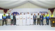Eng. Khaled Al Obaidly, Manager of Drainage Networks Operation and Maintenance in Ashghal (centre) with Metito-Qatar officials and others during an event appreciating its efforts in maintaining health and safety measures at work sites.