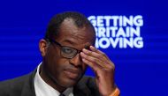British Chancellor of the Exchequer Kwasi Kwarteng adjusts his glasses during Britain's Conservative Party's annual conference in Birmingham, Britain, October 3, 2022. REUTERS/Toby Melville/File Photo