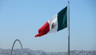 A Mexican flag is seen over the city of Tijuana, Mexico from San Ysidro, a district of San Diego, California, US, on April 21, 2017.  File Photo / Reuters

