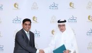 Chairman of Qatar Tourism and Qatar Airways Group Chief Executive H E Akbar Al Baker (right) and  Director of QnA International Ackash Jain after signing the agreement.