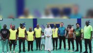 Participants pose for a photo during the walking football meet.