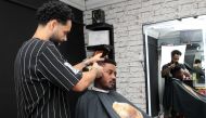 Houssem Sakka styling for Al Sadd Sports Club's Musaab Kheder. Pics: Salim Matramkot/The Peninsula
