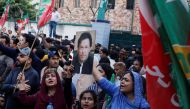 Supporters of the Pakistan Tehreek-e-Insaf (PTI) political party chant slogans as they gather, after Pakistan Election Commission disqualifies former Prime Minister Imran Khan on charges of unlawfully selling state gifts, during a protest in Karachi, Pakistan, October 21, 2022. (REUTERS/Akhtar Soomro)