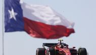 Scuderia Ferrari driver Carlos Sainz (55) passes the Texas flag during practice for the US Grand Prix at Circuit of the Americas in Austin, Texas, on October 21, 2022. Mandatory Credit: Erich Schlegel-USA TODAY Sports