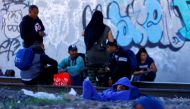 Venezuelan migrants, some expelled from the US to Mexico under Title 42 and others who have not crossed yet, stand near the Paso del Norte International border bridge, in Ciudad Juarez, Mexico, on October 21, 2022. REUTERS/Jose Luis Gonzalez