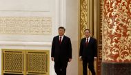 New Politburo Standing Committee members Xi Jinping and Li Qiang arrive to meet the media following the 20th National Congress of the Communist Party of China, at the Great Hall of the People in Beijing, China, on October 23, 2022. REUTERS/Tingshu Wang
