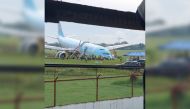 Response crews gather around a Korean Air Airbus A330 widebody flying from Seoul to Cebu, which tried to land twice in poor weather before it overran the runway on the third attempt on Sunday, in Lapu-Lapu City, Cebu, Philippines October 24, 2022 in this picture obtained from social media. Randyl Dungog/via REUTERS