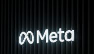 In this file photo taken on May 22, 2022 this photograph the logo of US multinational technology conglomerate Meta is displayed on a booth ahead of the World Economic Forum (WEF) annual meeting in Davos. Photo by FABRICE COFFRINI / AFP)