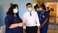 British Prime Minister Rishi Sunak speaks with members of staff as he visits Croydon University Hospital on October 28, 2022 in London, Britain. Leon Neal/Pool via REUTERS