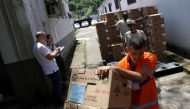 Workers prepare electronic ballot boxes for transport to voting stations ahead of the second round of Brazil's presidential election, in Rio de Janeiro, Brazil, on October 29, 2022. REUTERS/Ricardo Moraes