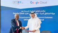 Minister of State and Chairman of QFZA H E Ahmad Al Sayed exchanges the agreement with Thomas Kurian, CEO of Google Cloud.
