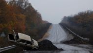 A destroyed car is seen on the main road, as Russia's invasion of Ukraine continues, in the eastern Donbas region of Bakhmut, Ukraine, October 30, 2022. Reuters/Clodagh Kilcoyne